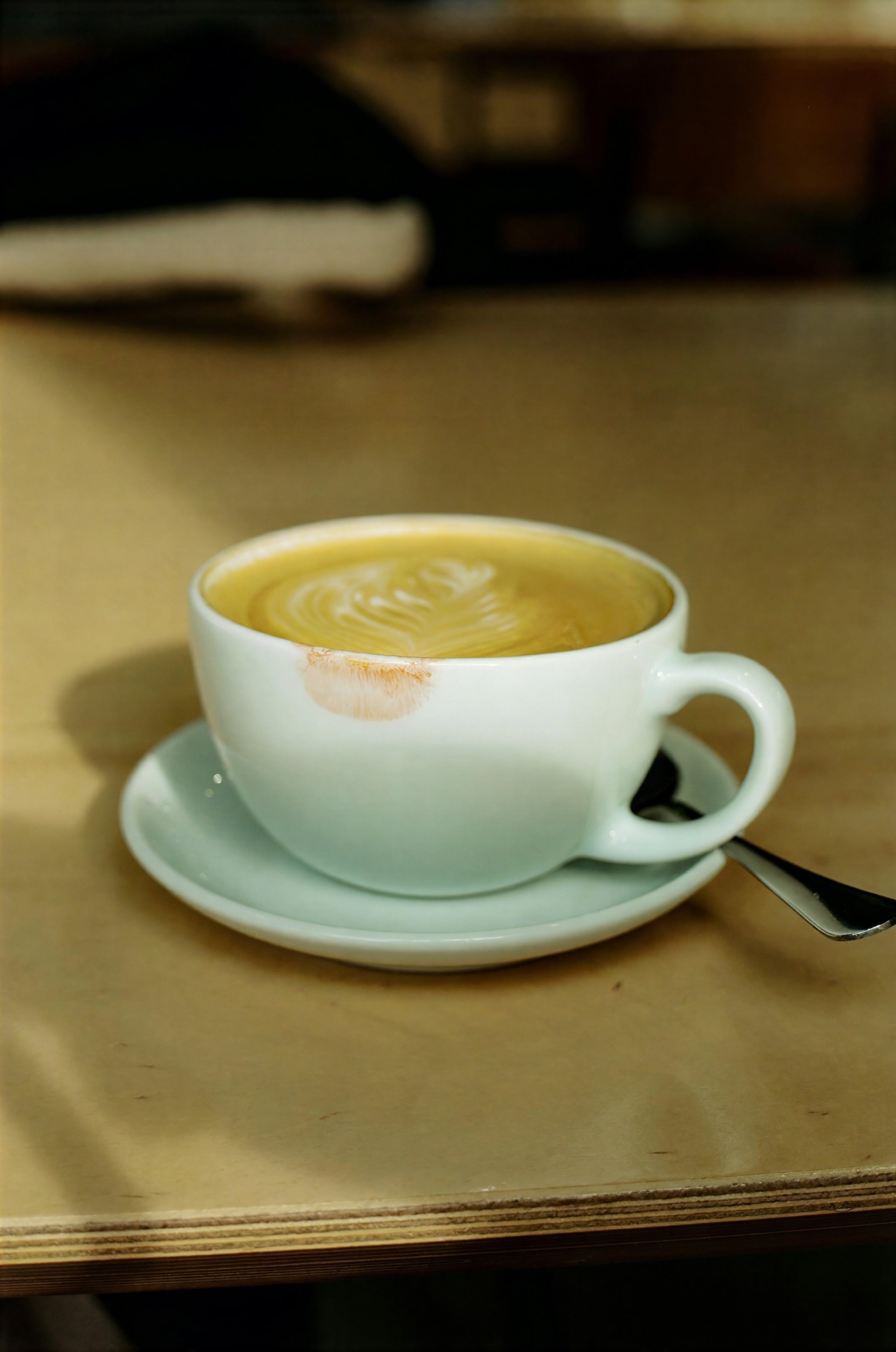 A cup of coffee on a wooden table